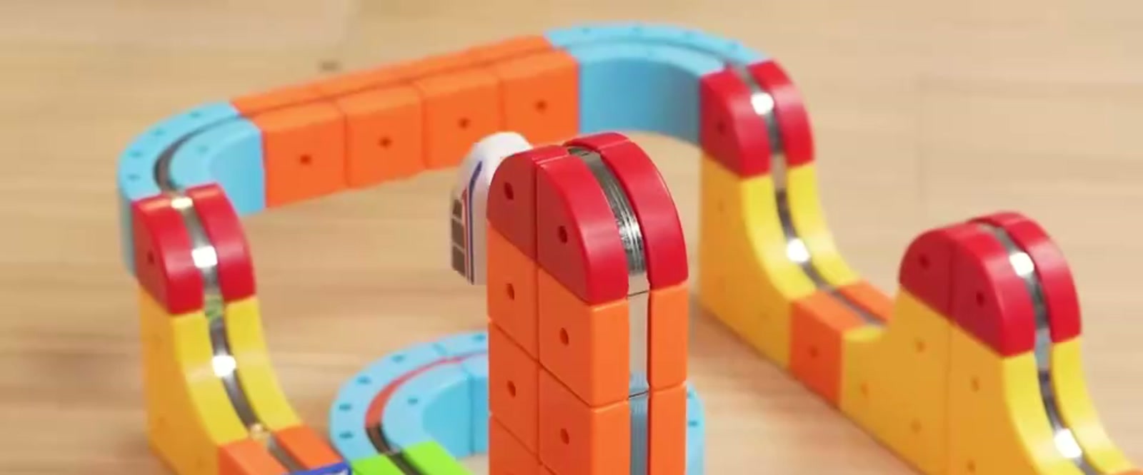 Magnetic track building set laid out on a floor